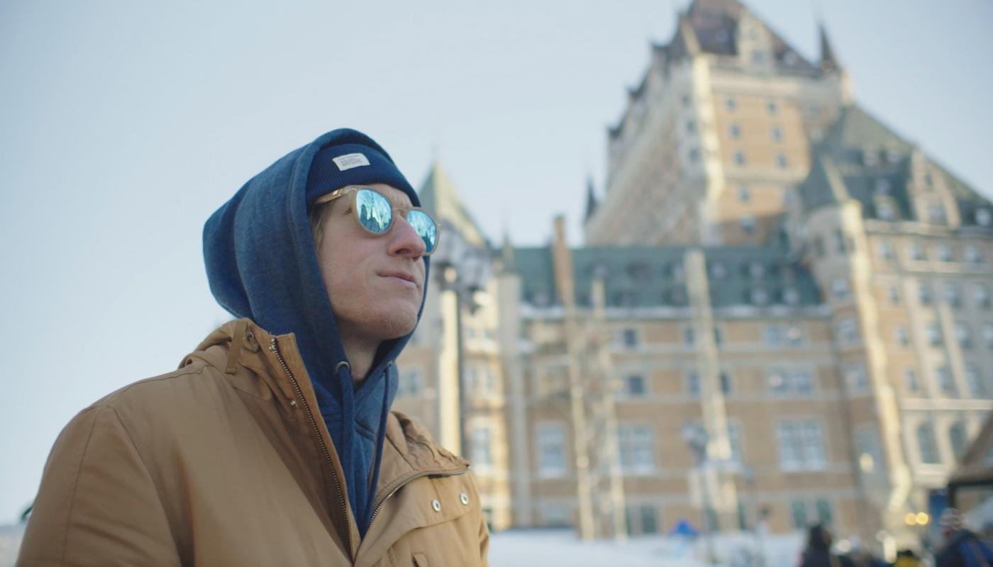 Timothy is standing in front of the Château Frontenac