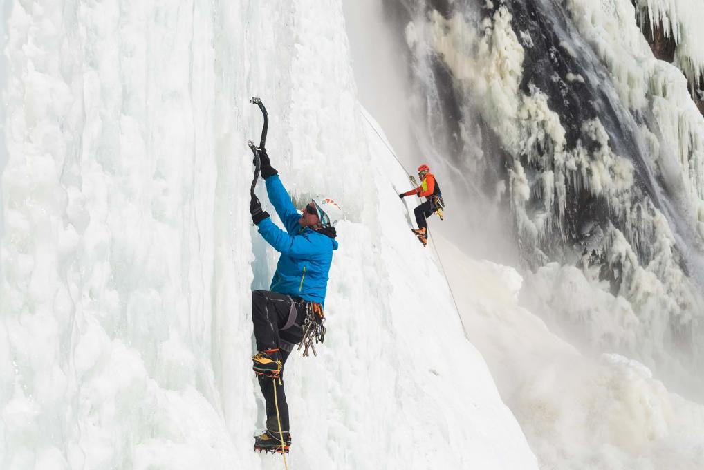 Two climbers climb an ice wall at Parc de la Chute-Montmorency, the highest waterfall in Canada.