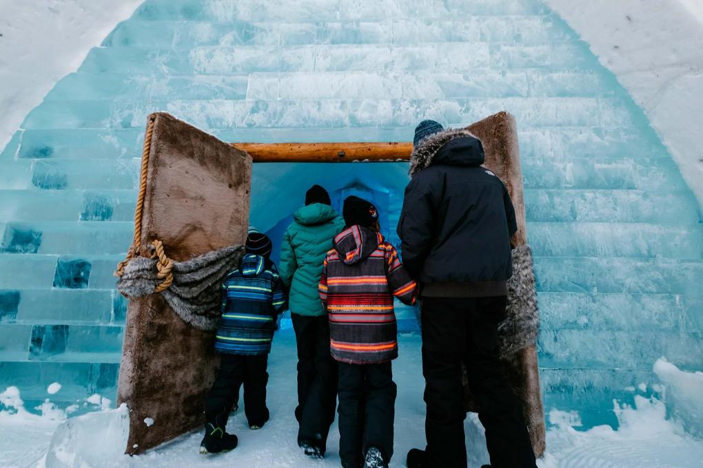A family entering inside the Ice Hotel