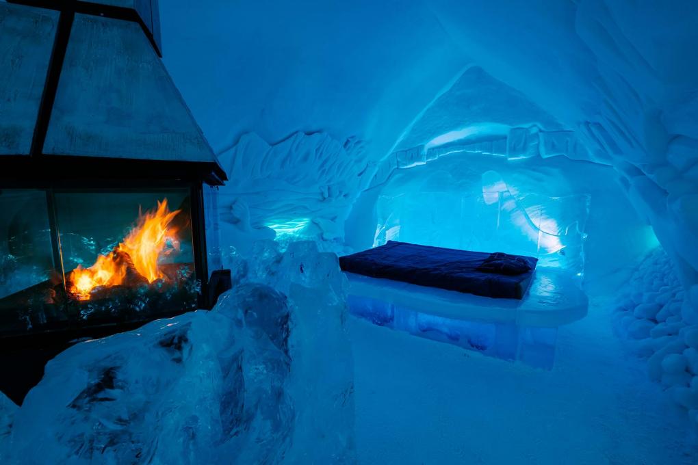 Room with a fireplace inside the Ice Hotel