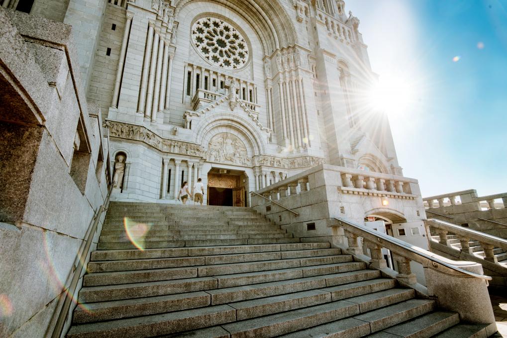 Front and exterior steps of the Sanctuary of Sainte-Anne-de-Beaupré on a sunny summer day.