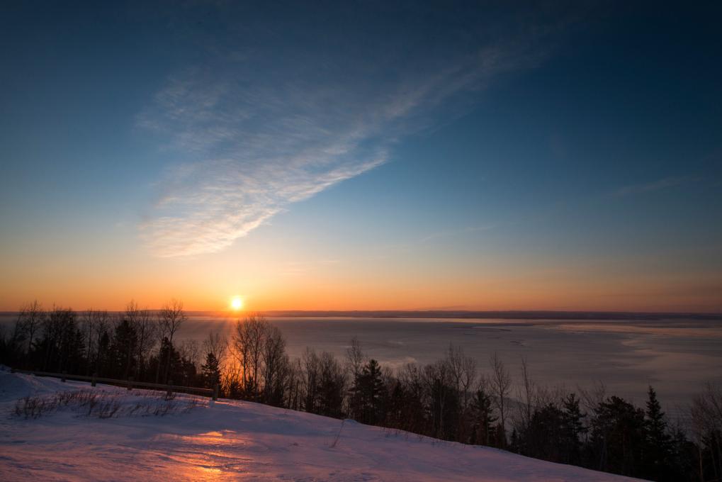 Sunset over the St. Lawrence River in winter in Charlevoix
