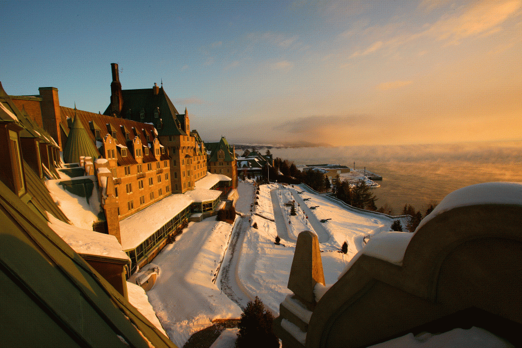 View of Hotel Fairmont Le Manoir Richelieu and of the St. Lawrence River in winterLaurent