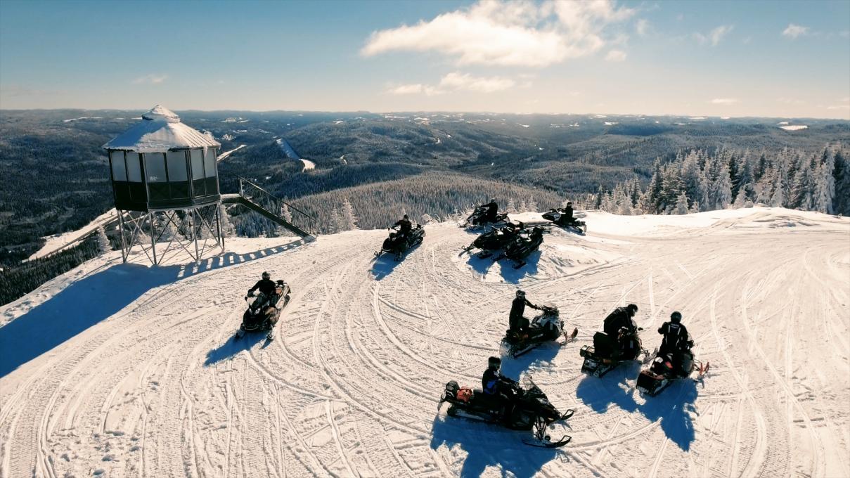 Snowmobilers at the top of Mont-Apica in Saguenay-Lac-Saint-Jean