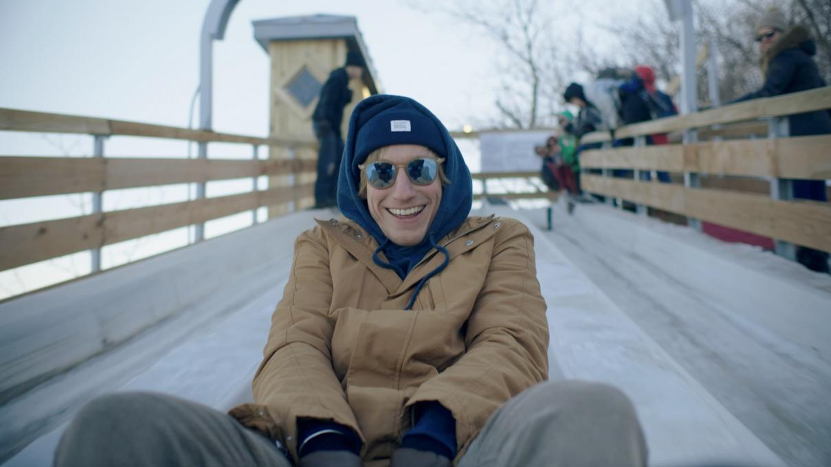 Timothy slides the toboggan run on the Dufferin Terrace