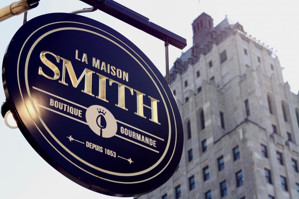 La Maison Smith - Des Jardins - sign and view of the Price building