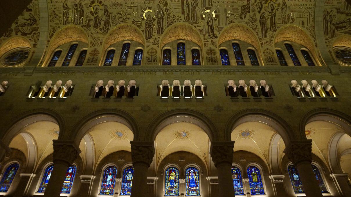 The illuminated wall of the nave in the Shrine of Sainte-Anne-de-Beaupré.