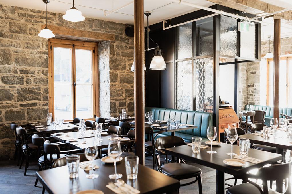 Louise Taverne & Bar à Vin - dining room with stone walls