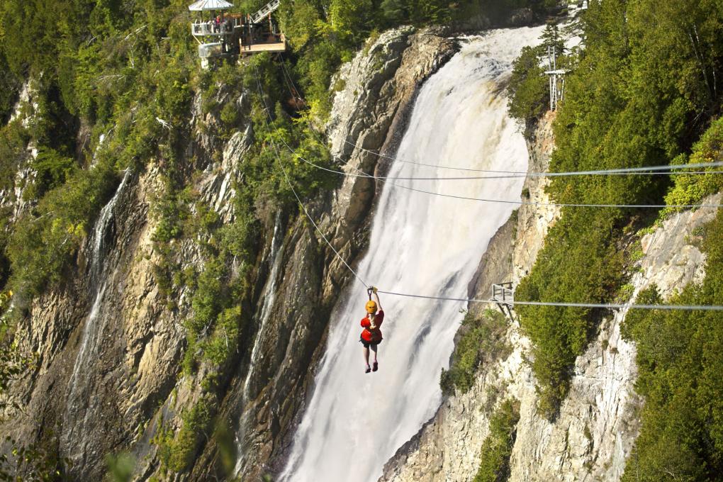 The zip line at Parc de la Chute-Montmorency with the waterfall in the background.
