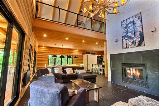 Au Chalet en Bois Rond - Salon chaleureux au chalet Le Tomahawk