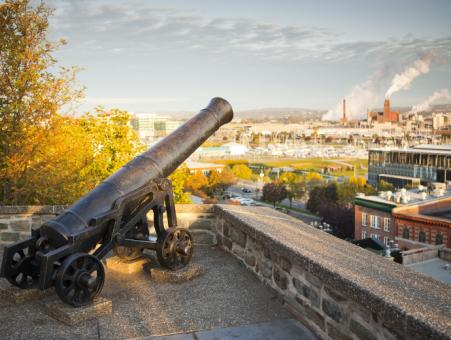 A cannon and the view of Québec City from the Fortifications-de-Québec National Historic Site.