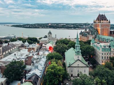 Aerial view of Old Québec, the St. Lawrence River, the Château Frontenac and the Holy Trinity Church. 