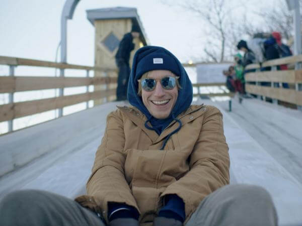 Timothy slides the toboggan run on the Dufferin Terrace