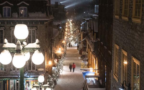 Romantic walk on rue du Petit-Champlain, illuminated and decorated in winter.