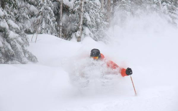 A skier makes a descent in powder snow at the Massif de Charlevoix.