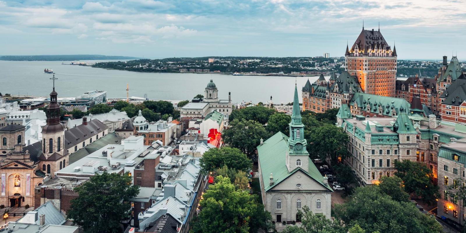 Aerial view of Old Québec, the St. Lawrence River, the Château Frontenac and the Holy Trinity Church. 