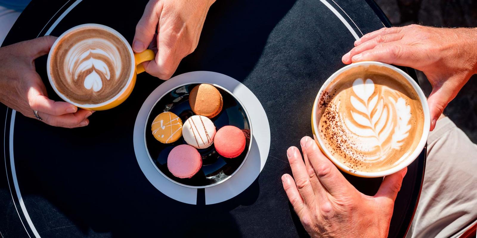 Macaroons and coffee tasting on a terrace of La Maison Smith, in summer.