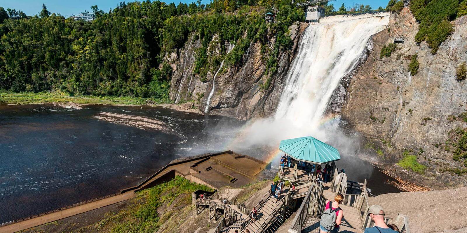 Visitors walk the stairs at Chute-Montmorency Park in summer.