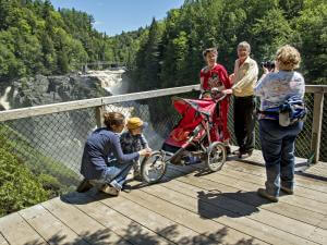 A family takes a picture of themselves on the lookout at Canyon Sainte-Anne, near Québec City.