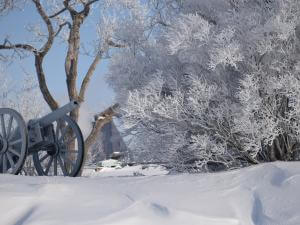 Cannon in winter and snowy outdoor landscape at La Citadelle de Québec.