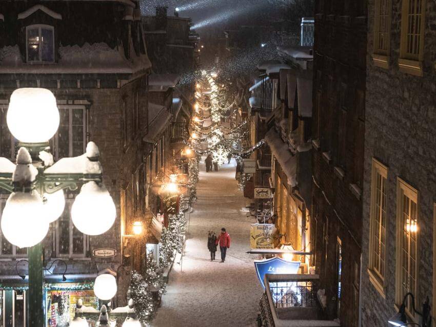Romantic walk on rue du Petit-Champlain, illuminated and decorated in winter.