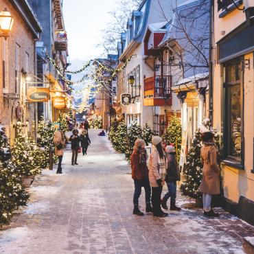 Family in Petit-Champlain decorated for Christmas