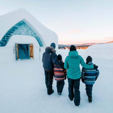 A family entering into the Ice Hotel